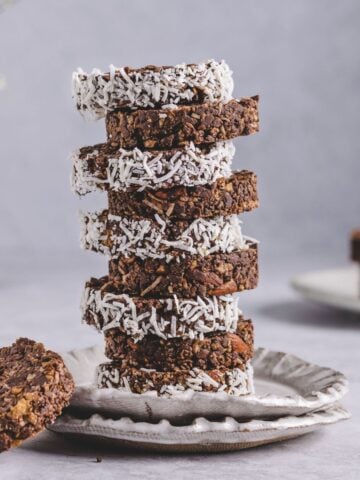 a photo of stacked cornflake cakes garnished with coconut shreds