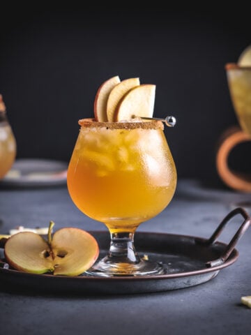 a glass of rum cider cocktail