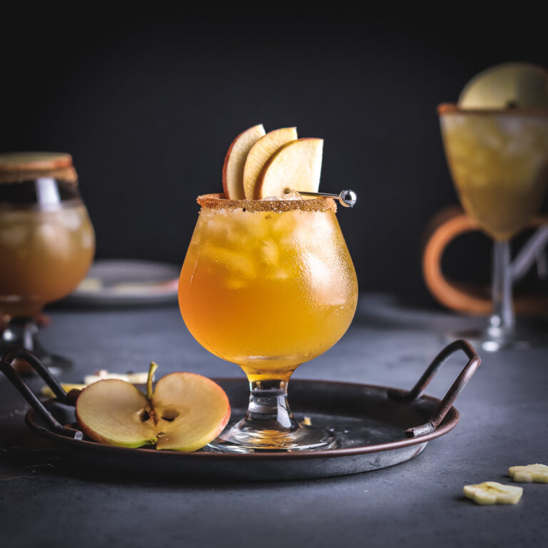 a glass of rum cider cocktail