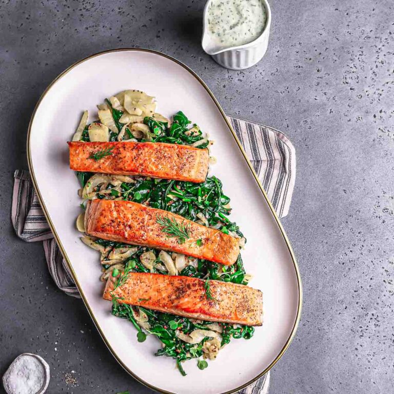 seared salmon served with greens