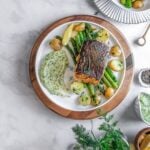 halibut steak on a plate with veggies