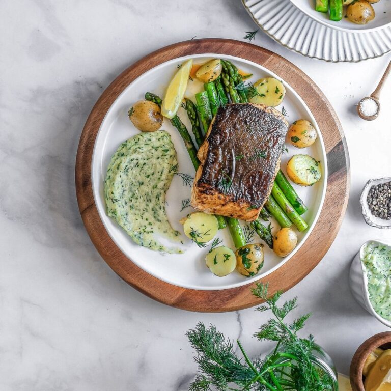 halibut steak on a plate with veggies