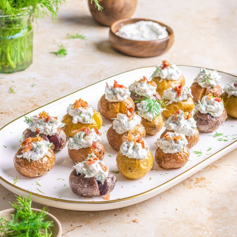 new potatoes with dill cream on a platter