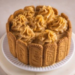lotus biscoff cake with biscoff buttercream on a white plate.