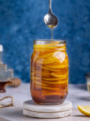 Homemade lemons with honey in a jar.