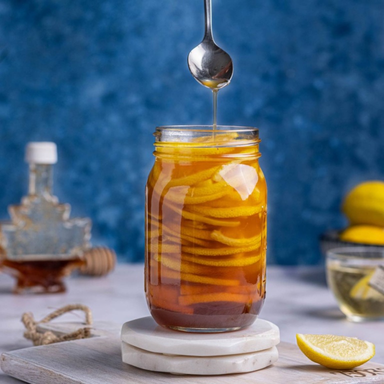 Homemade lemons with honey in a jar.