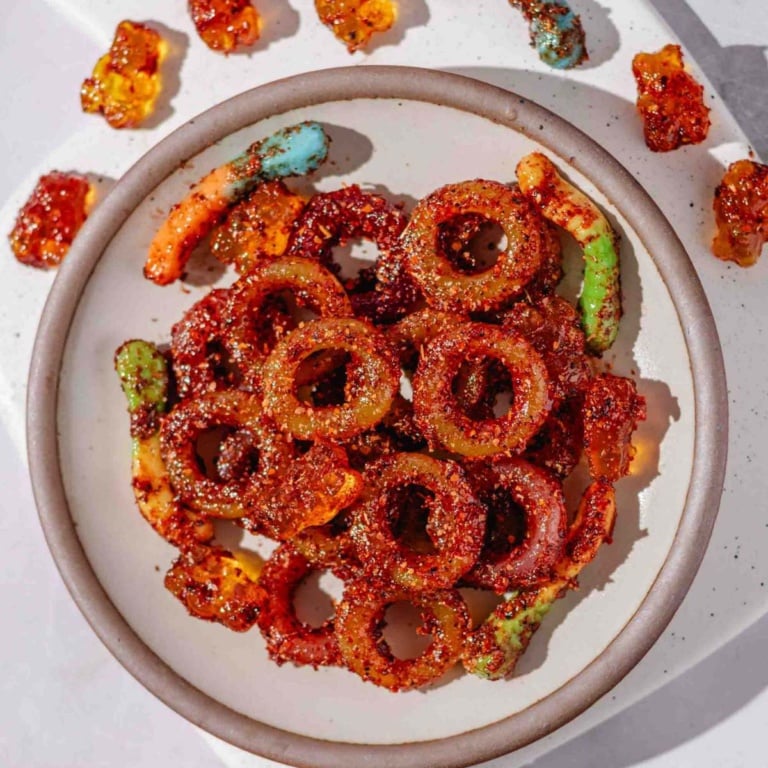 candies coated in tajin seasoning and chamoy sauce.