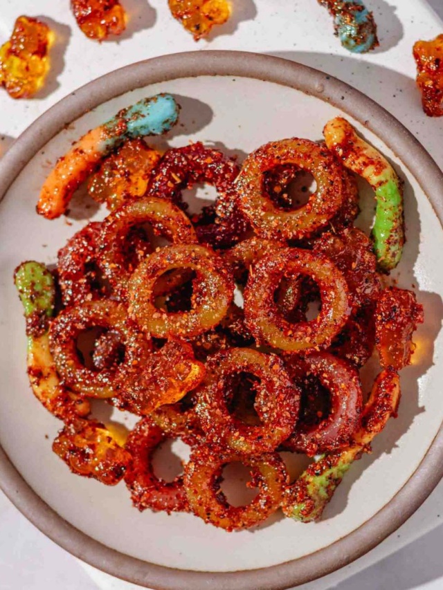 candies coated in tajin seasoning and chamoy sauce.
