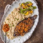 Attieke or acheke cassava couscous with air fried fish and pepper sauce.