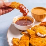 Hot honey chicken tenders on a platter.