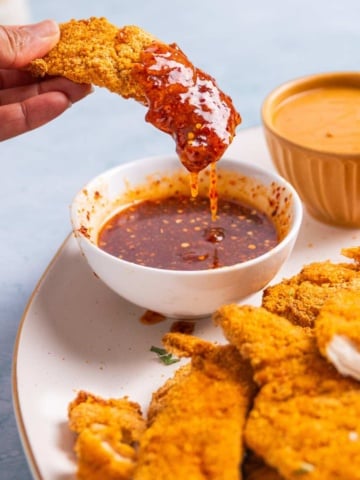 Hot honey chicken tenders on a platter.