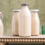 Tiger nut milk in a bottle on a flat surface.