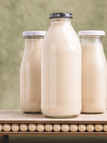 Tiger nut milk in a bottle on a flat surface.