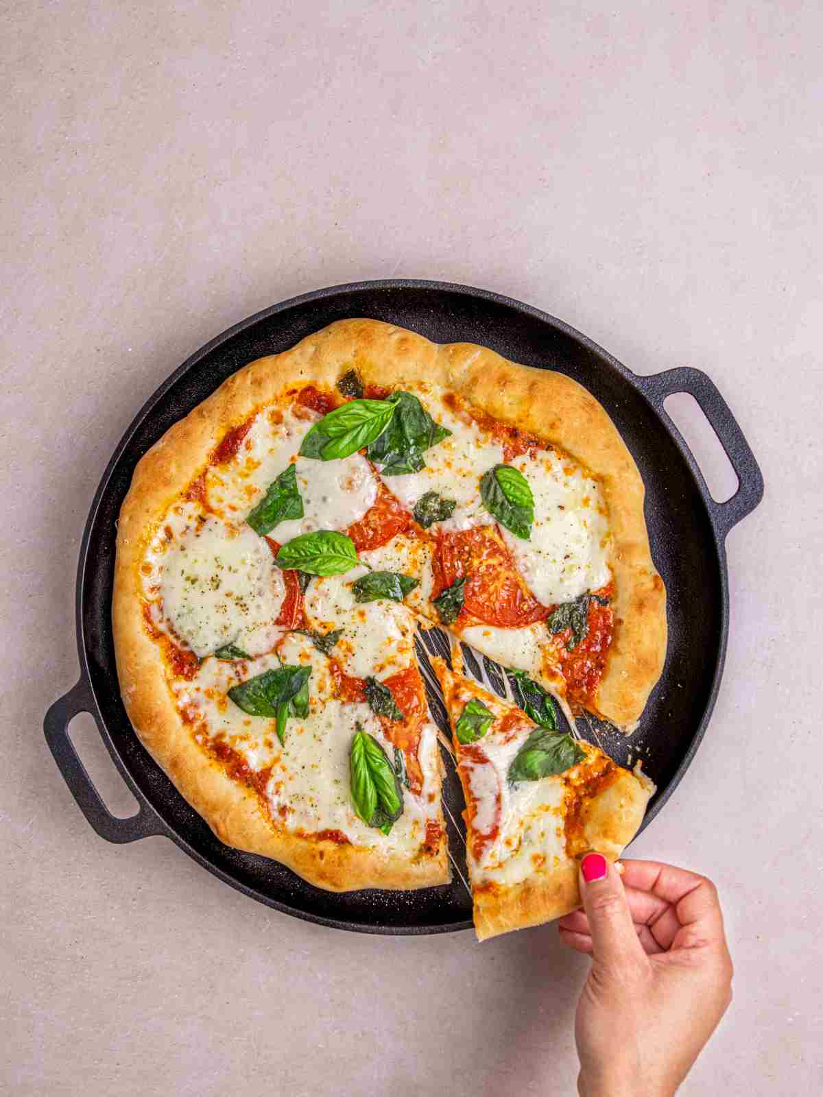 A slice of pizza on a pan.
