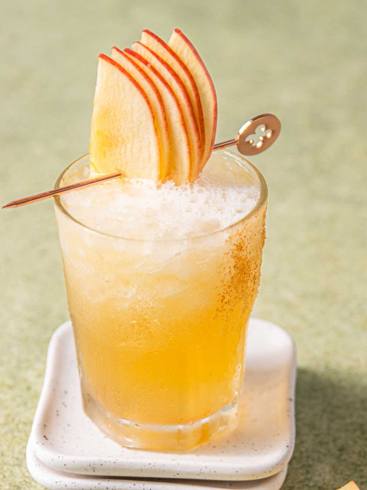 Ginger ale topped with bourbon in a glass.