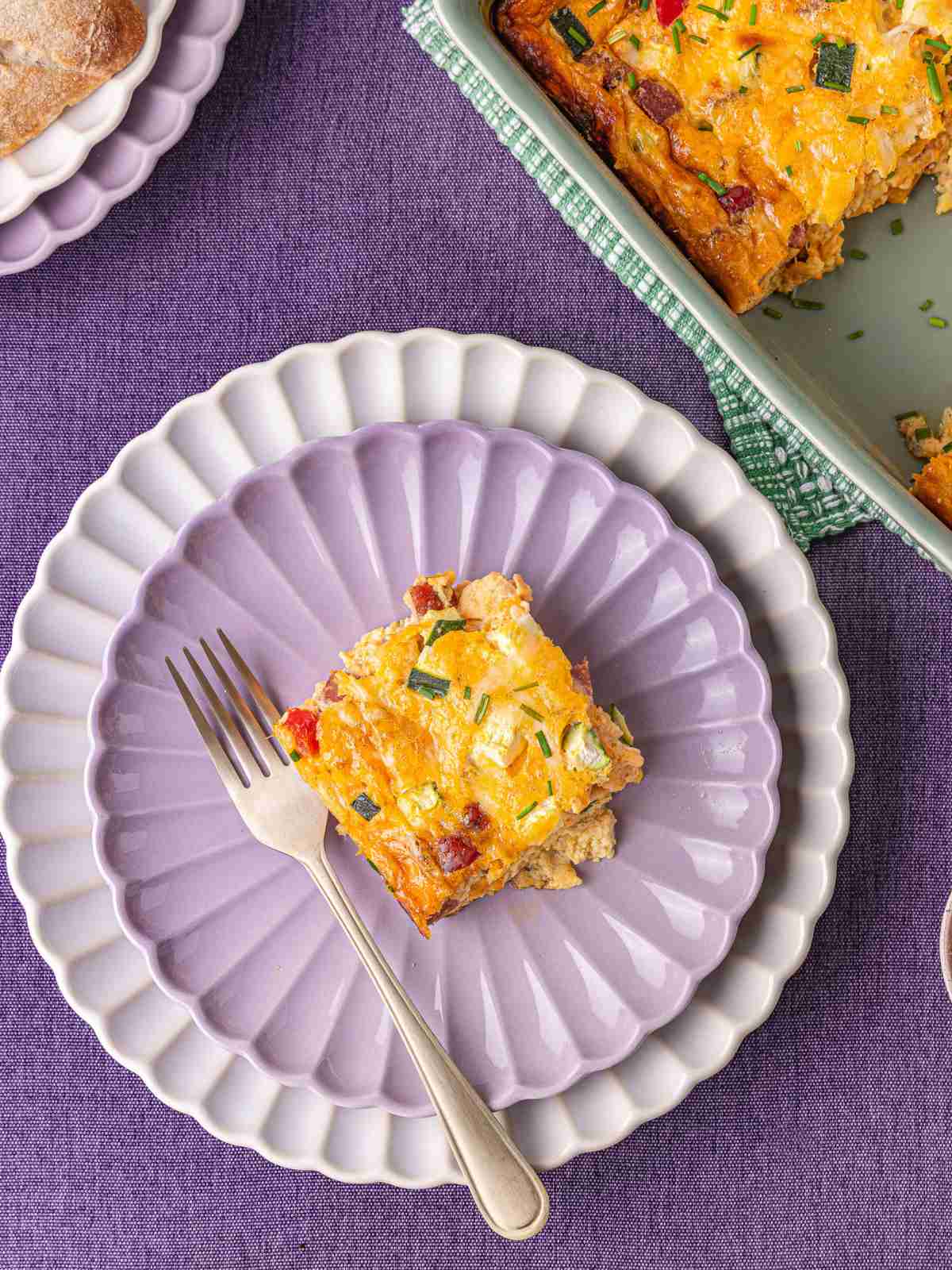 A slice of cheesy egg bake on a plate.