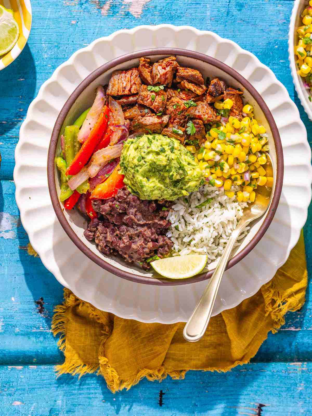 smoky chipotle steak with rice, beans, and vegetables.