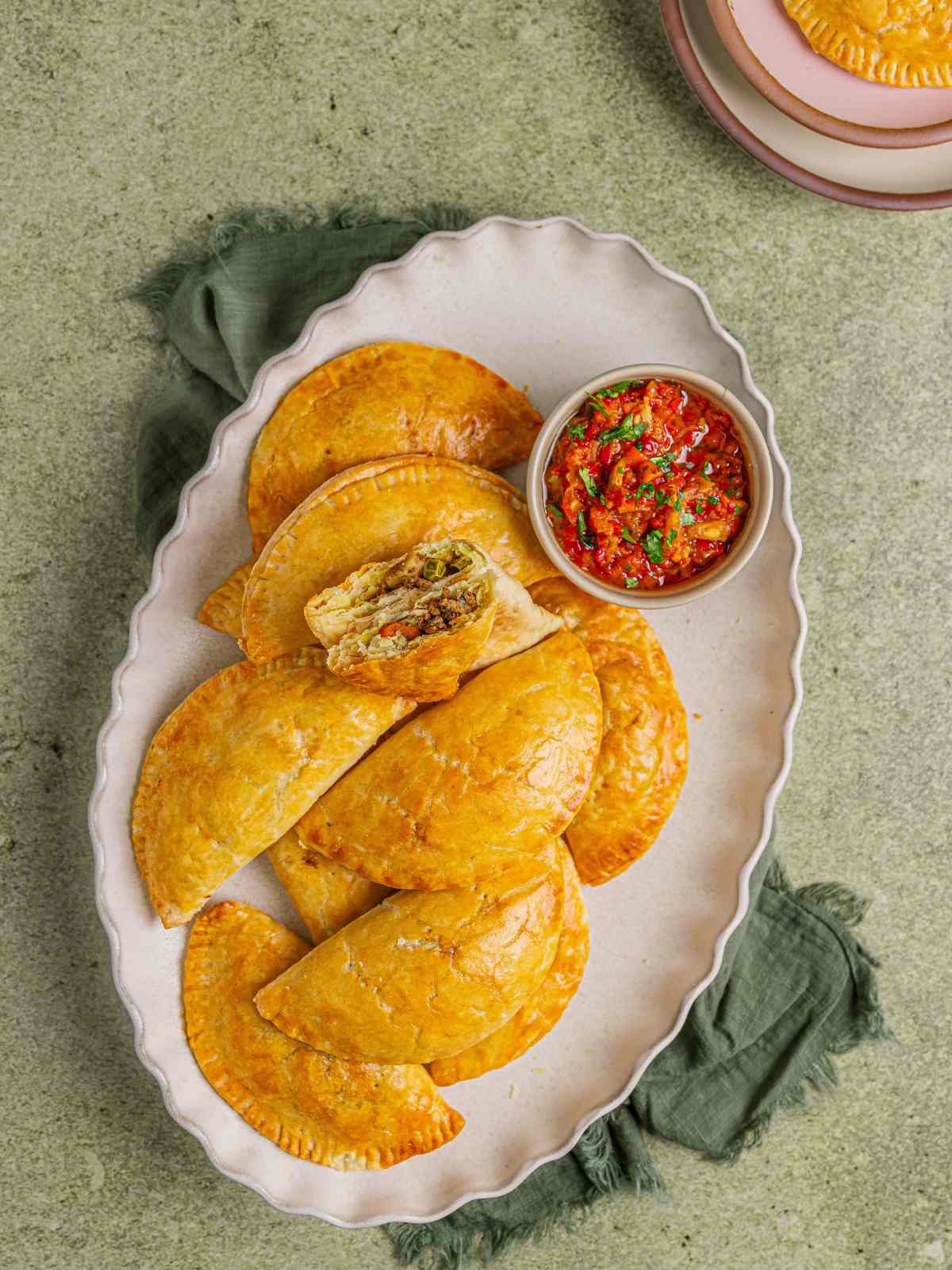Meat pies on a serving platter.