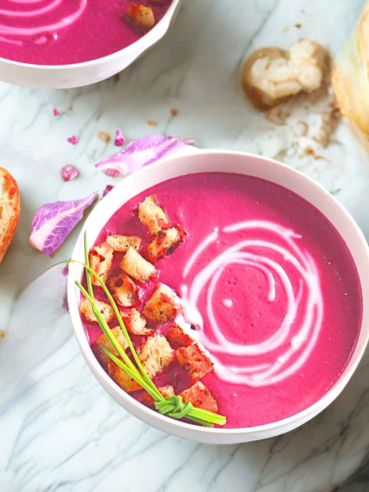 Leek soup with roasted veggies in a bowl.
