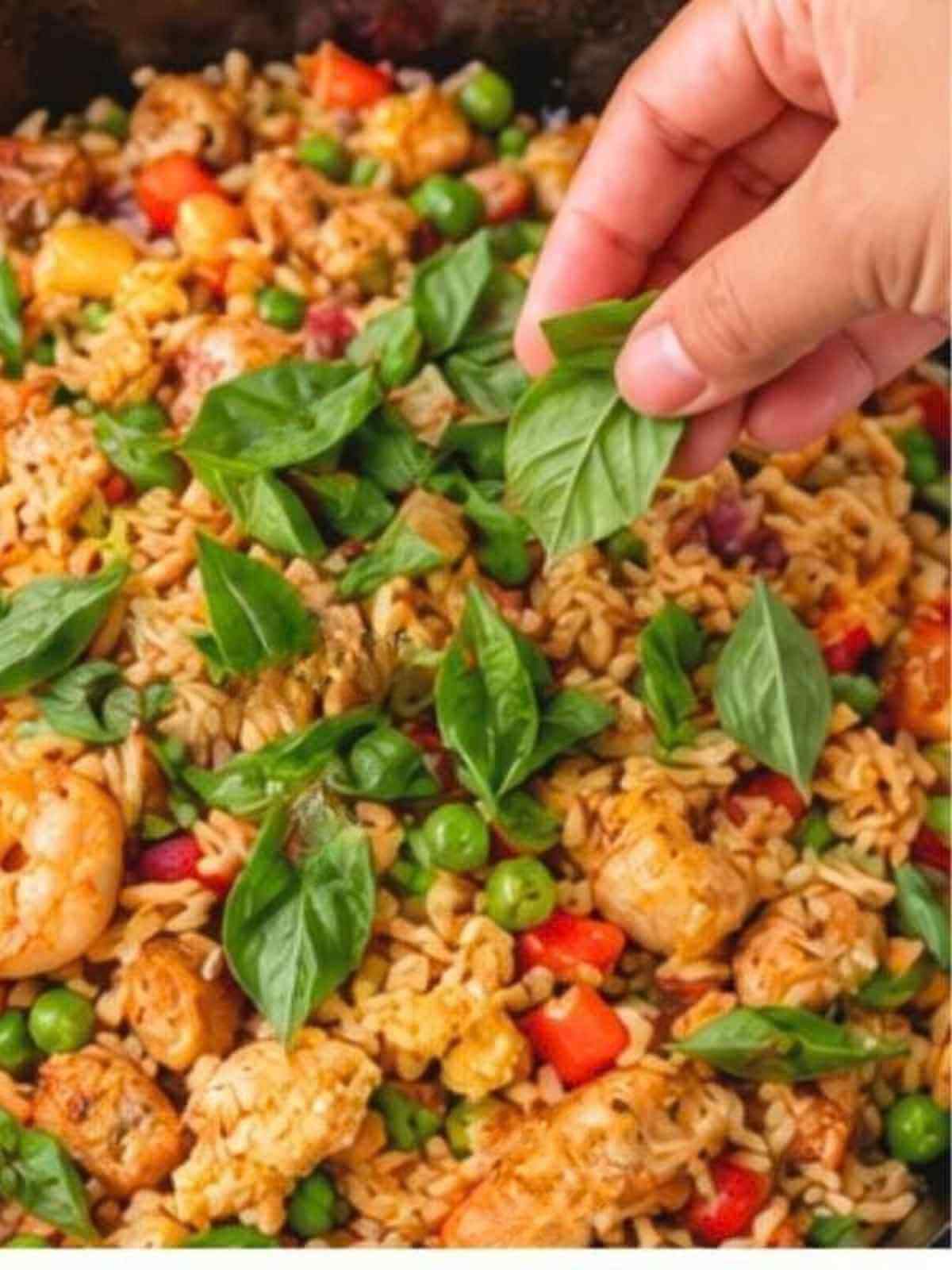 Adding the Thai basil.
