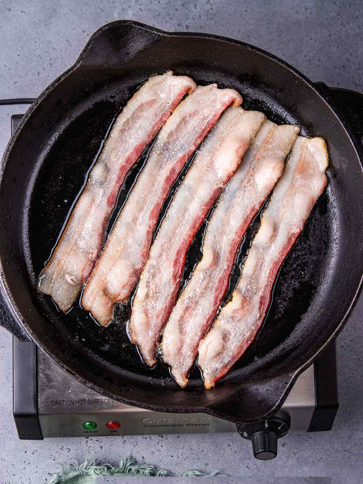 Cooking the bacon.