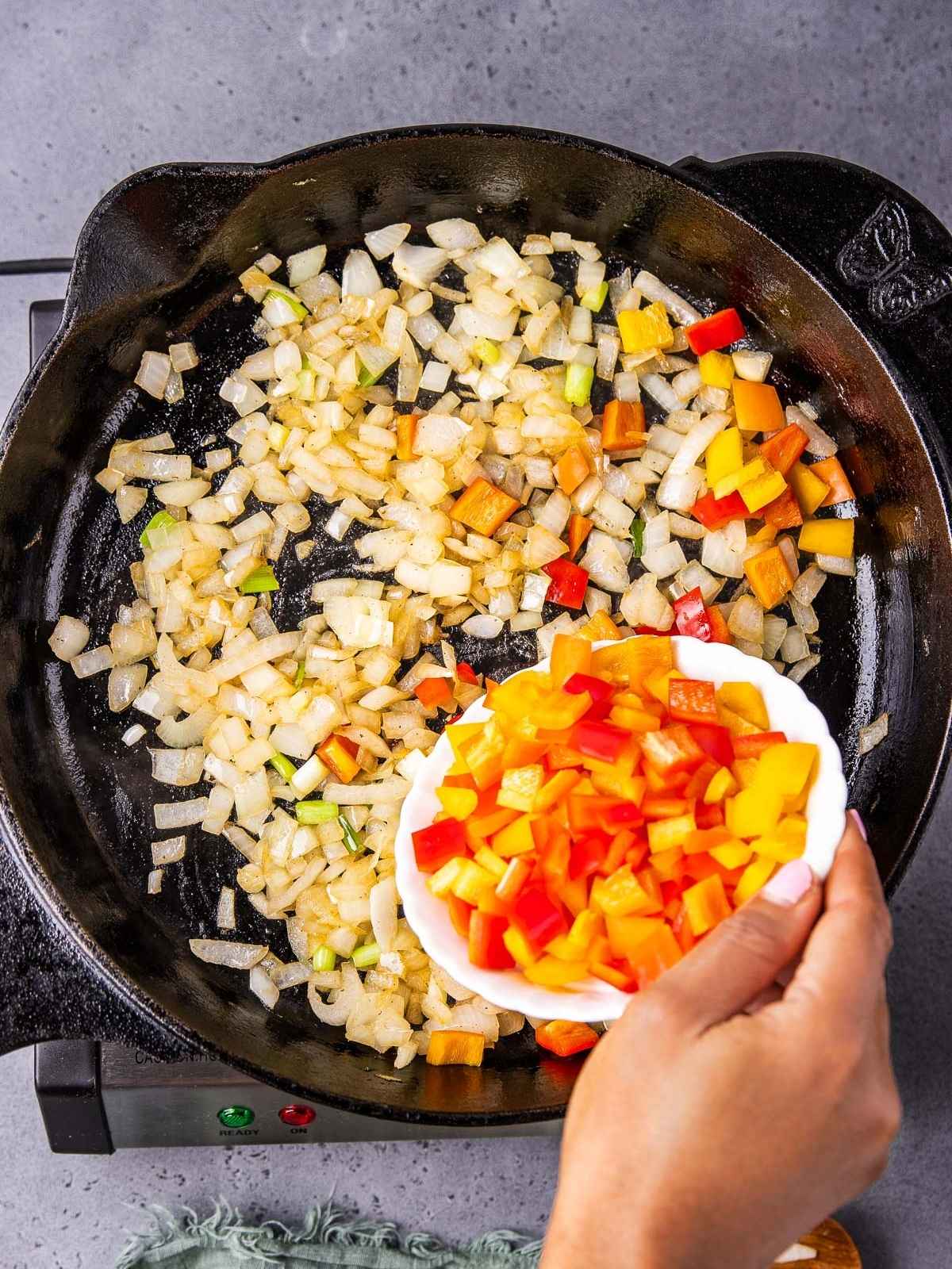 Sautéing the onion and peppers.