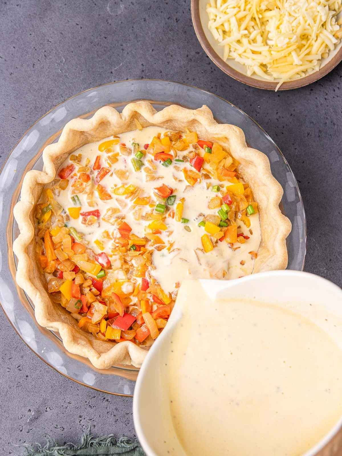 Adding the egg mixture into the pie dish.