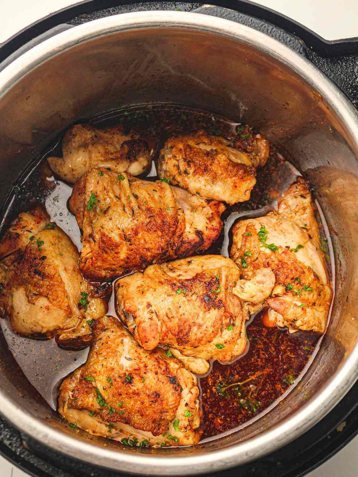 Crispy chicken thighs in an instant pot with gravy.